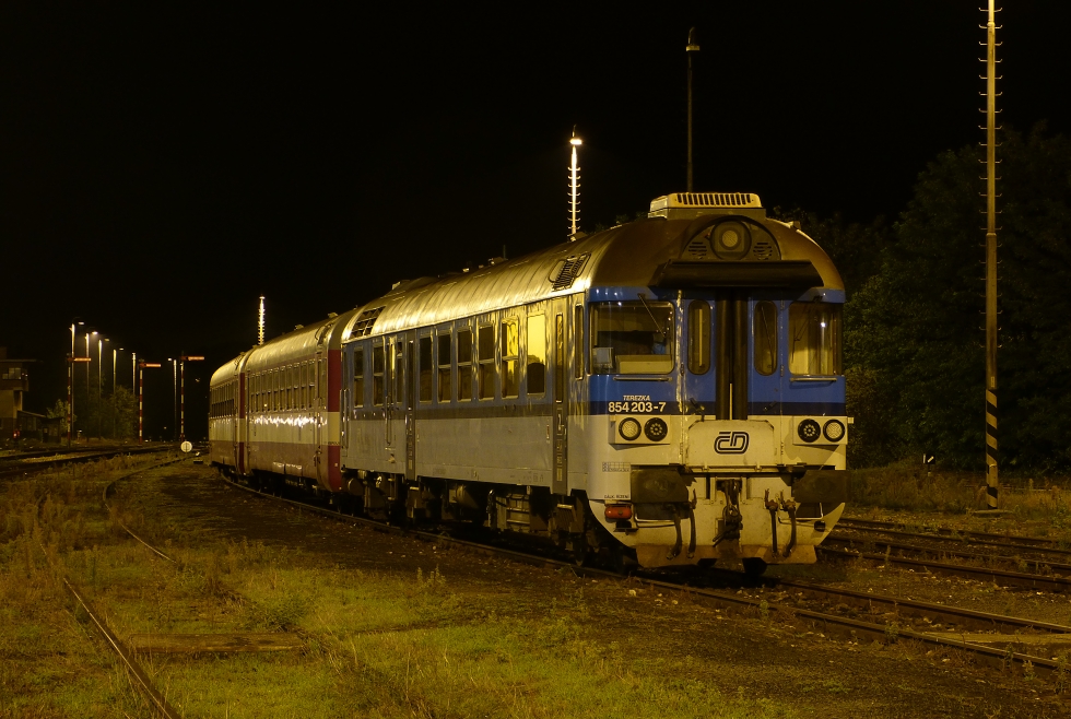 854 203-7